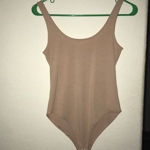 Nude colored body suit